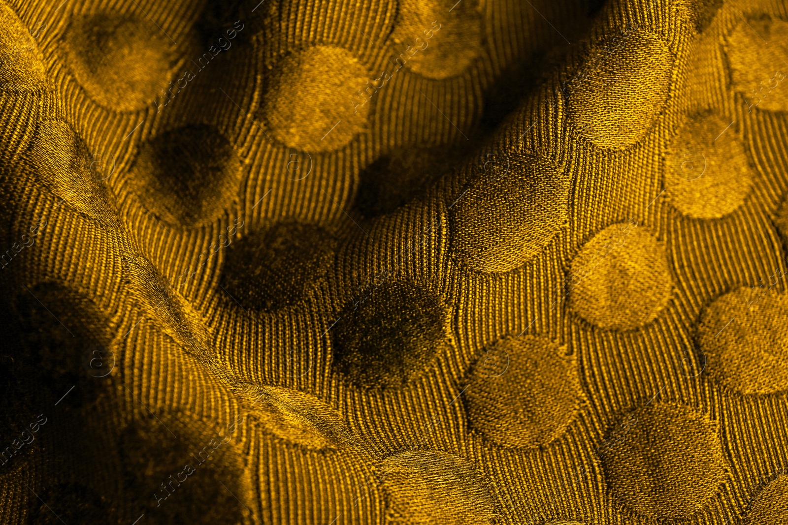 Image of Textured golden fabric as background, closeup view