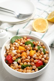 Photo of Delicious fresh chickpea salad on light grey marble table