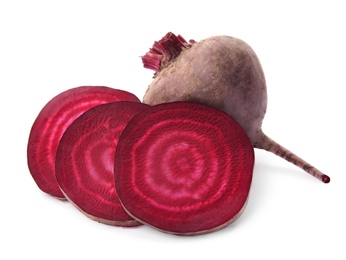 Photo of Whole and cut fresh red beets on white background