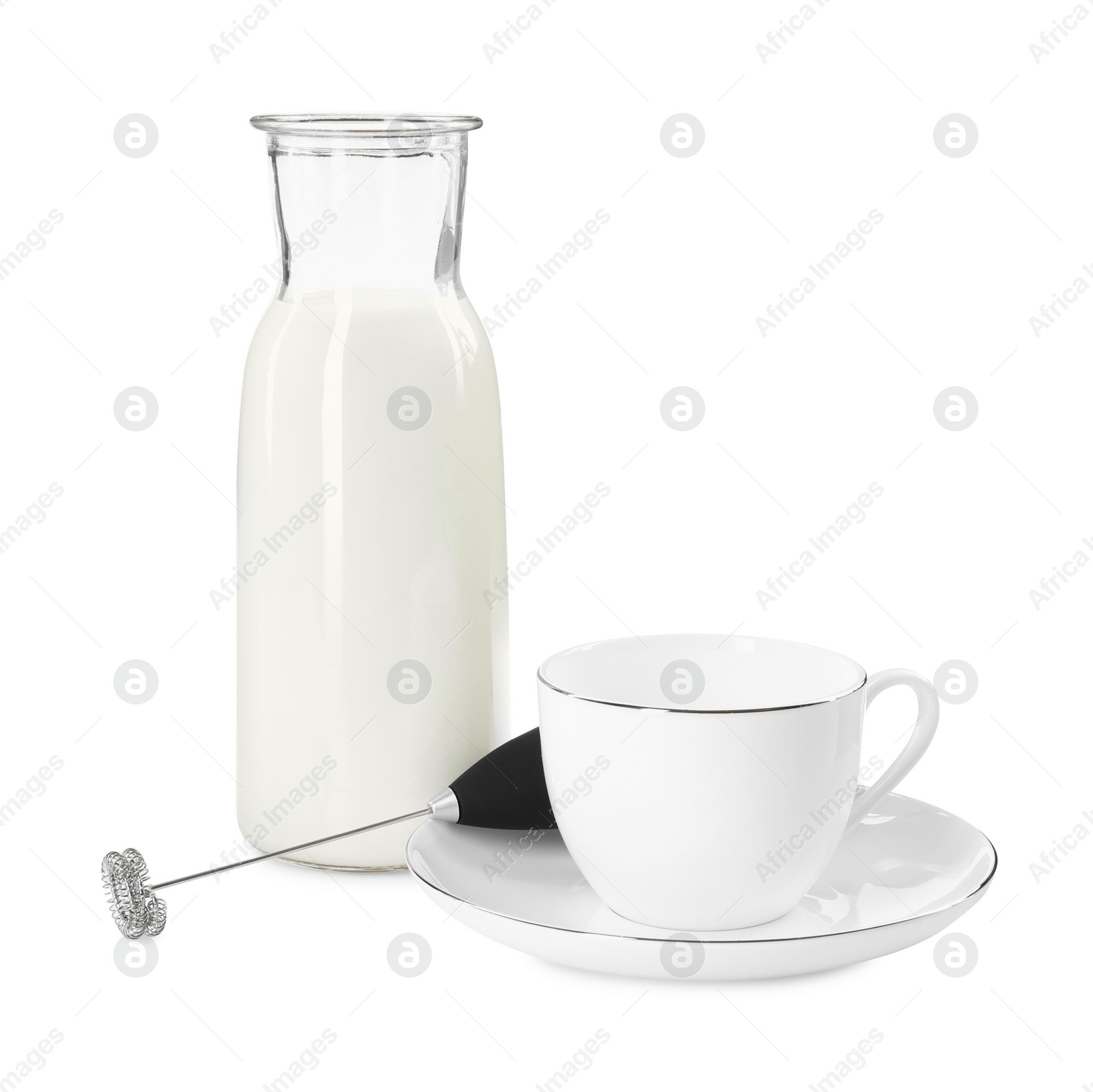 Photo of Milk frother wand, cup and glass carafe isolated on white