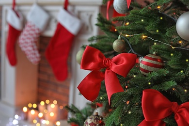 Photo of Christmas tree with stylish decor indoors, closeup