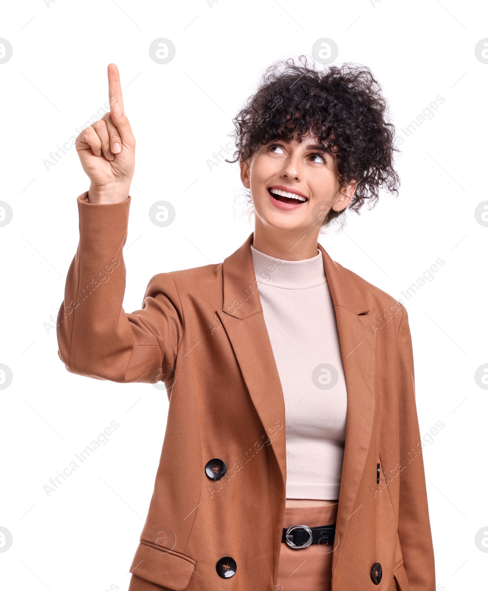 Photo of Beautiful happy businesswoman pointing at something on white background