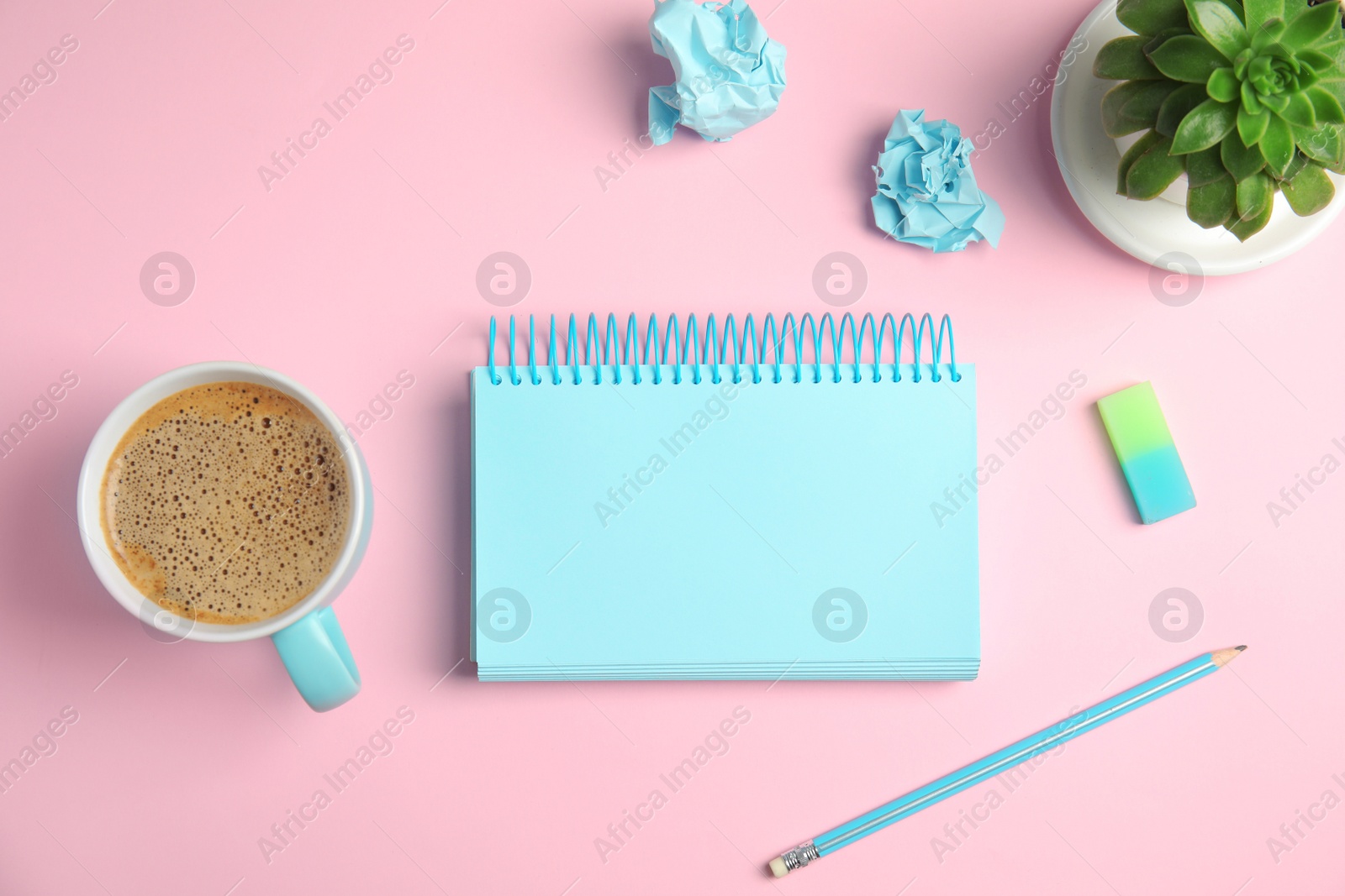 Photo of Flat lay composition with notebook and coffee on color background