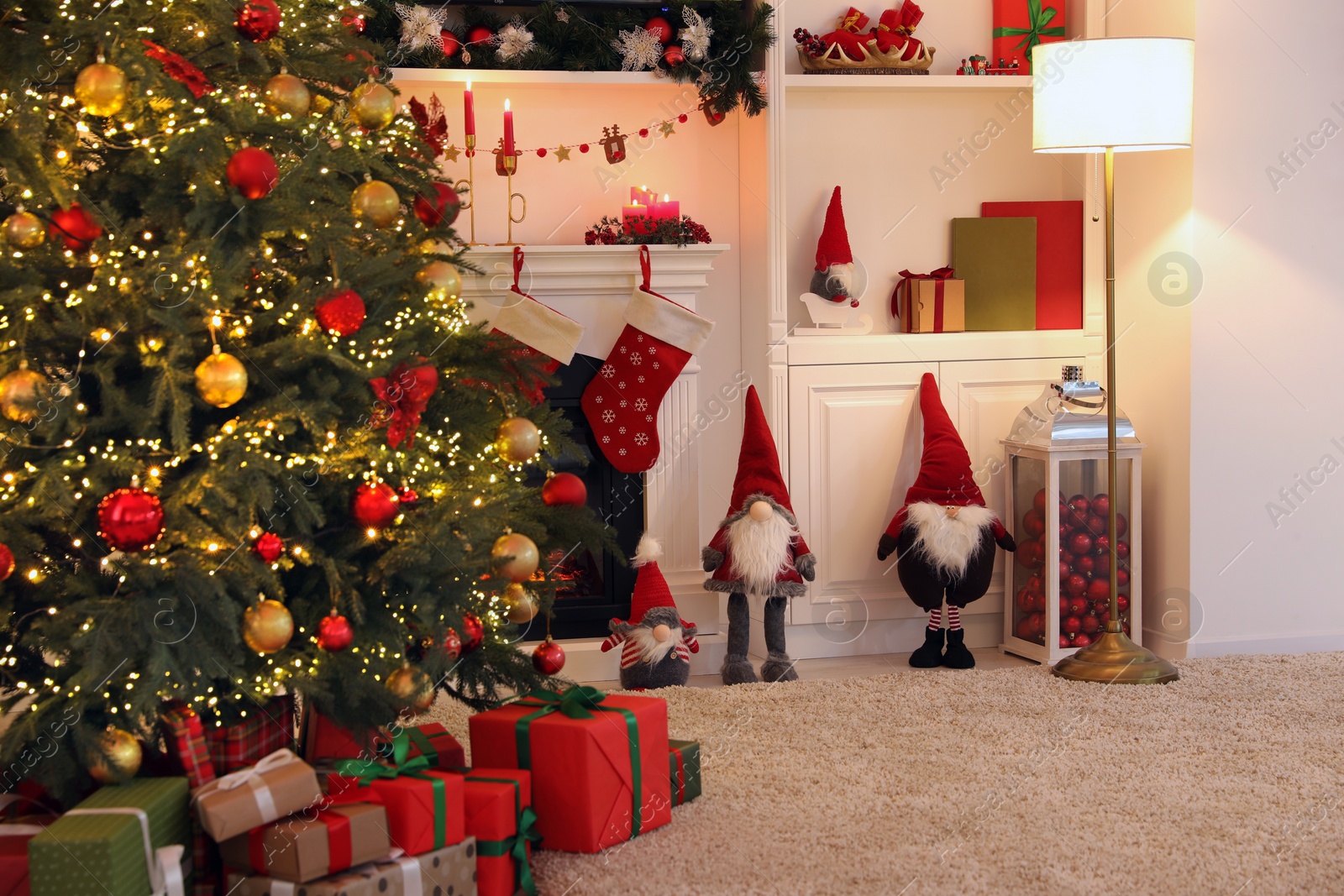 Photo of Living room interior with fireplace and festive decor. Christmas celebration