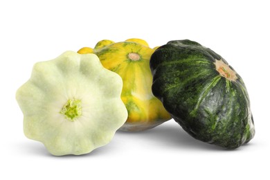 Image of Three fresh different pattypan squashes on white background