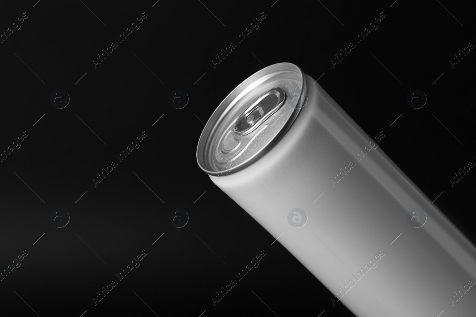 Photo of White can of energy drink on black background, closeup. Space for text