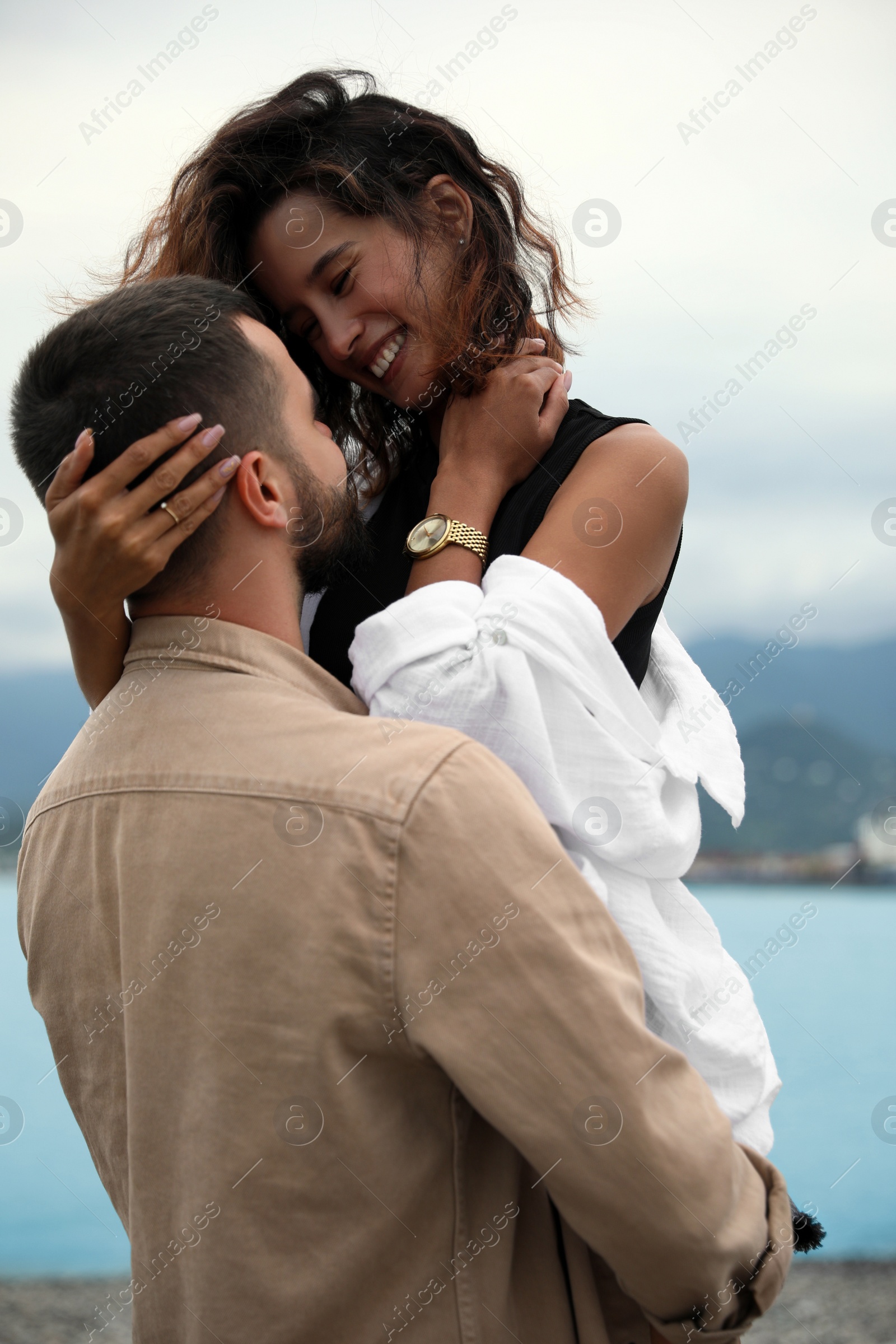 Photo of Beautiful young couple enjoying time together on beach