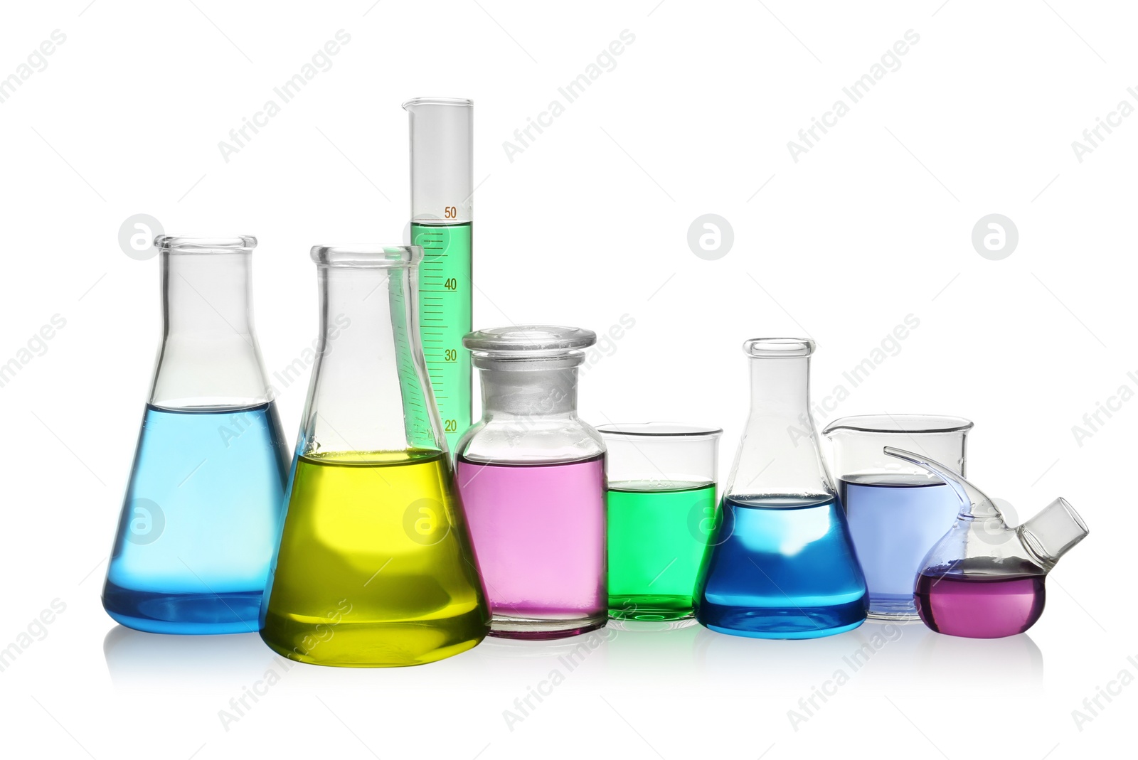 Photo of Laboratory glassware with colorful liquids on white background