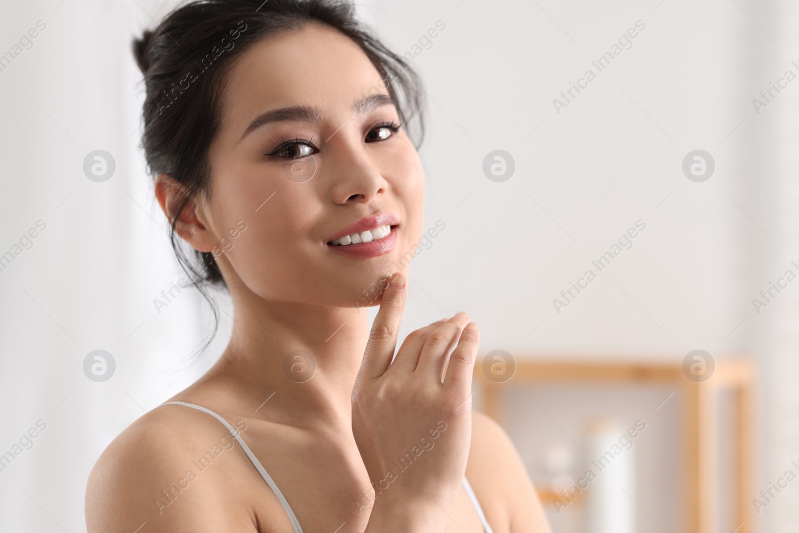 Photo of Portrait of beautiful woman with perfect skin indoors, space for text