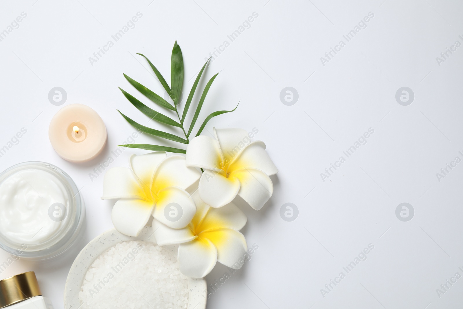 Photo of Composition with bath salt on white background, top view. Spa treatment