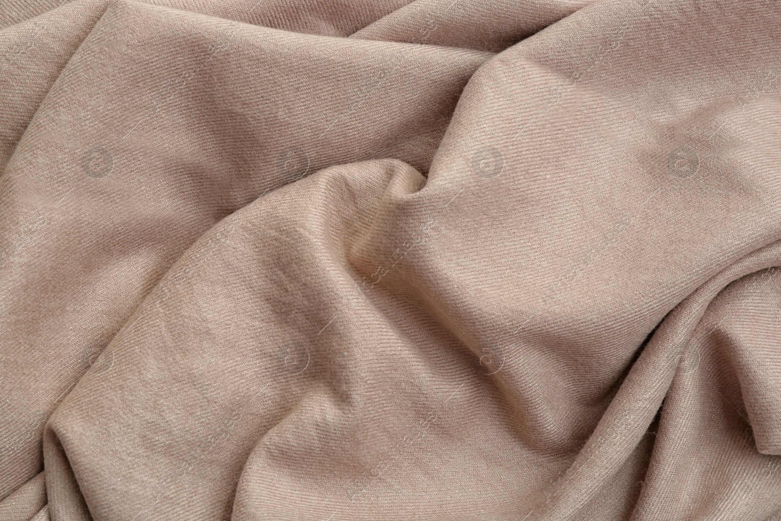 Photo of Light brown cloth as background, closeup view