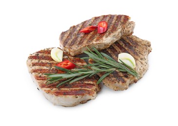 Delicious grilled pork steaks and spices on white background