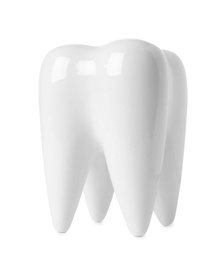 Photo of Ceramic model of tooth on white background. Dental care