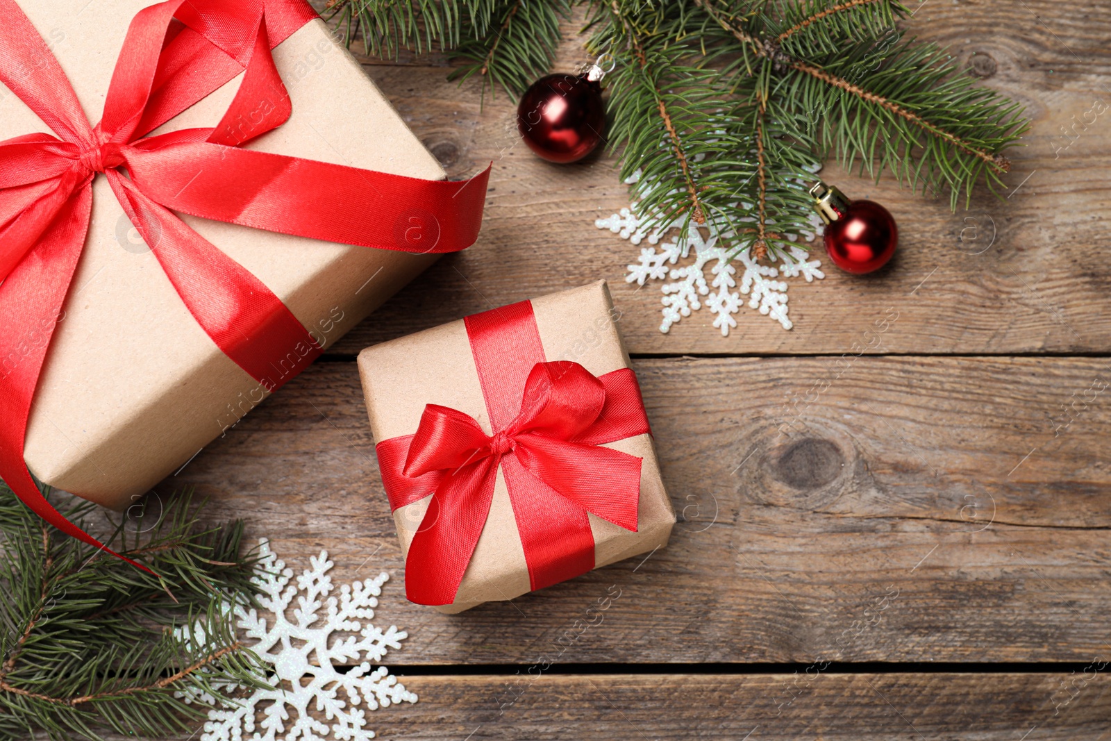 Photo of Flat lay composition with Christmas gift boxes on wooden table