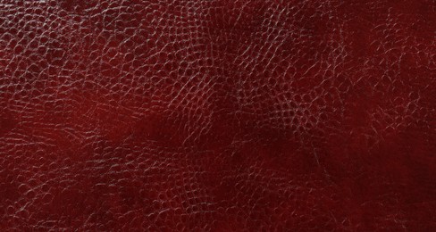 Photo of Beautiful red leather as background, top view