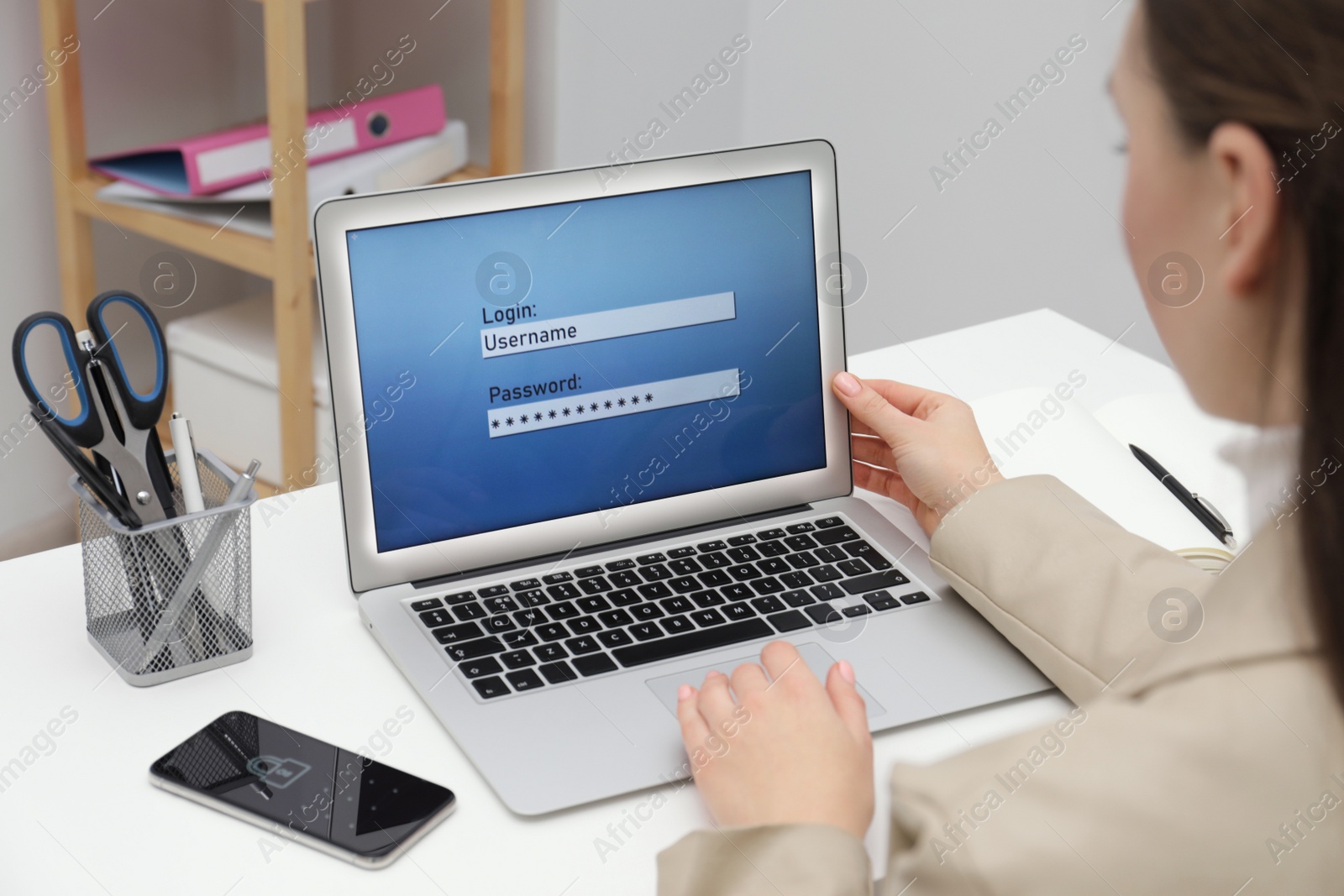 Photo of Woman unlocking laptop with blocked screen indoors, closeup