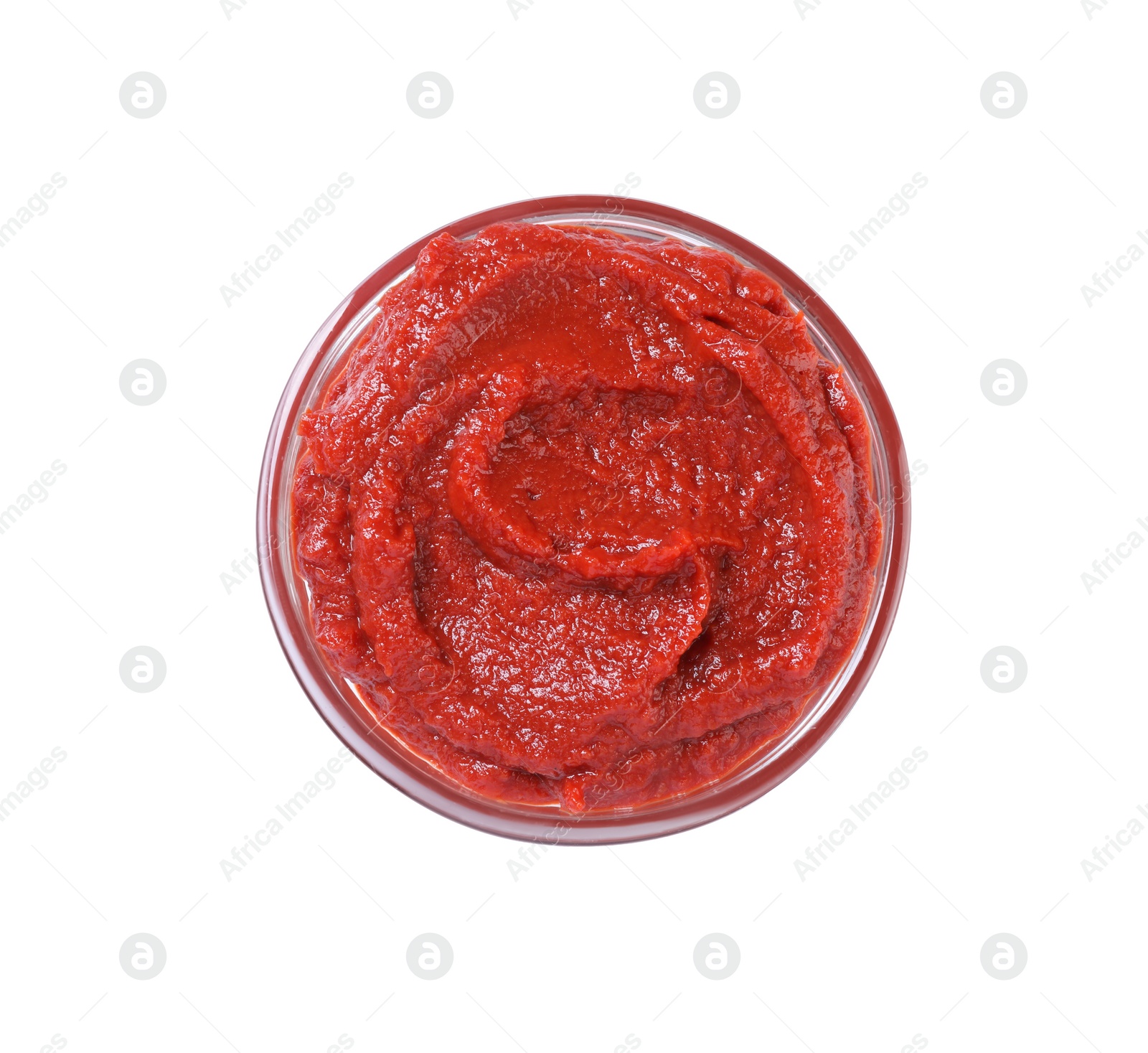 Photo of Glass bowl of tasty tomato paste isolated on white, top view