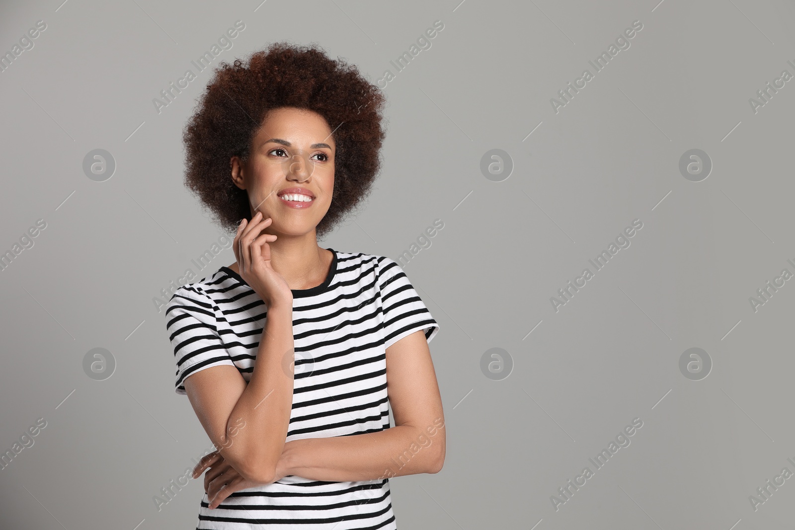 Photo of Portrait of beautiful young woman on grey background. Space for text