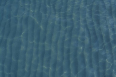 Beautiful sea water surface with ripples as background, top view