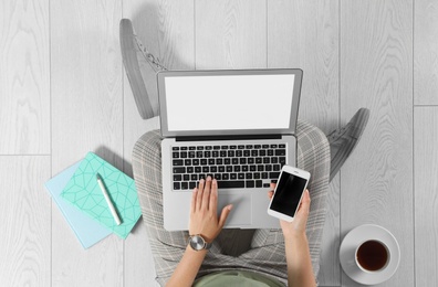 Top view of woman with laptop sitting on floor, closeup. Mockup for design