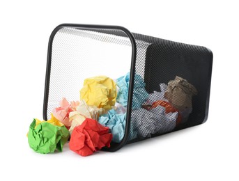 Photo of Basket with scattered crumpled paper balls on white background