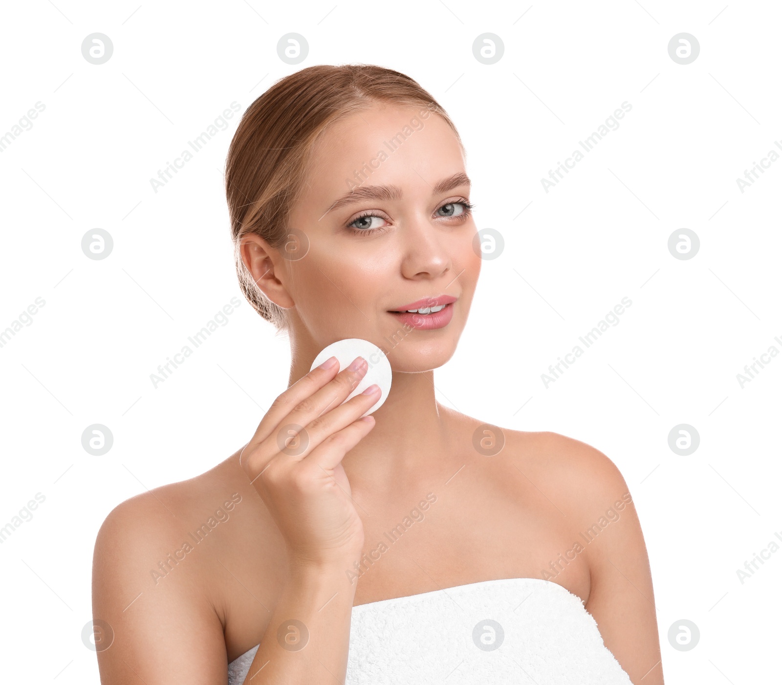 Photo of Beautiful young woman with cotton pad on white background