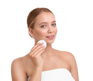 Photo of Beautiful young woman with cotton pad on white background