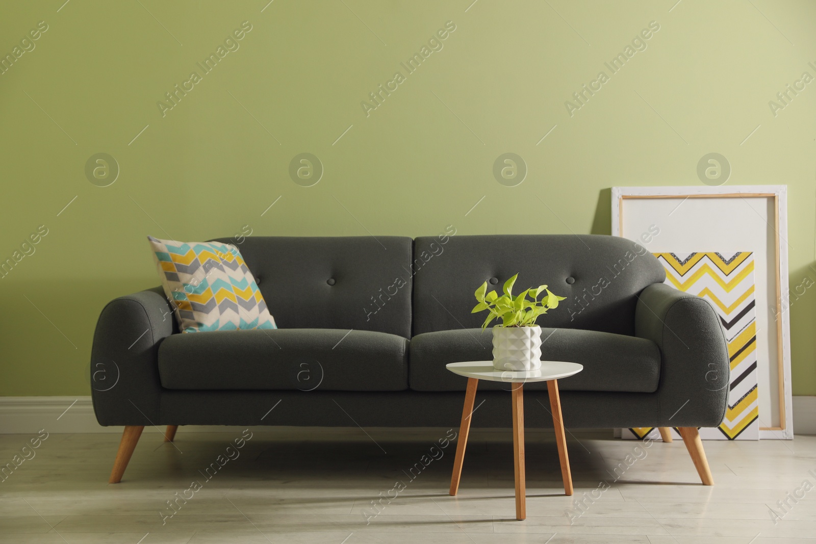 Photo of Stylish comfortable sofa in room. Interior design