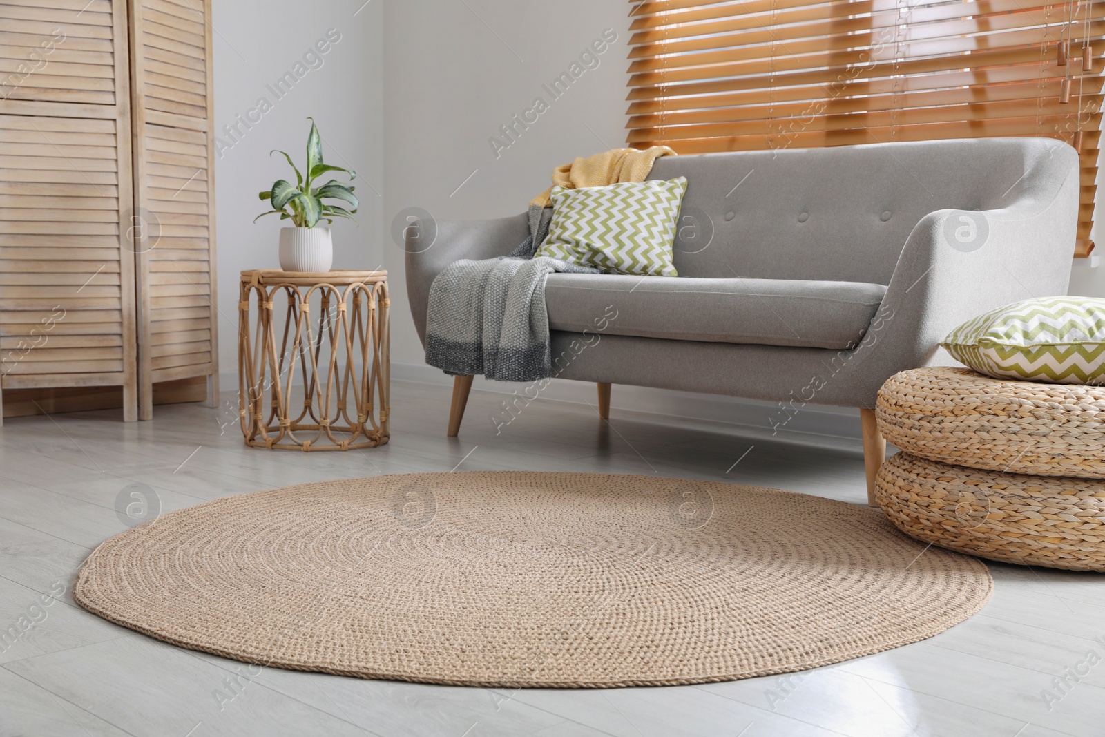 Photo of Stylish rug on floor in living room