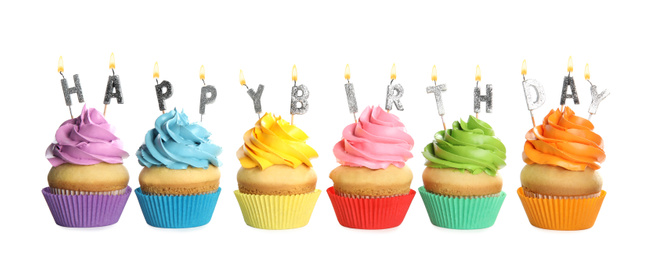 Photo of Birthday cupcakes with candles on white background