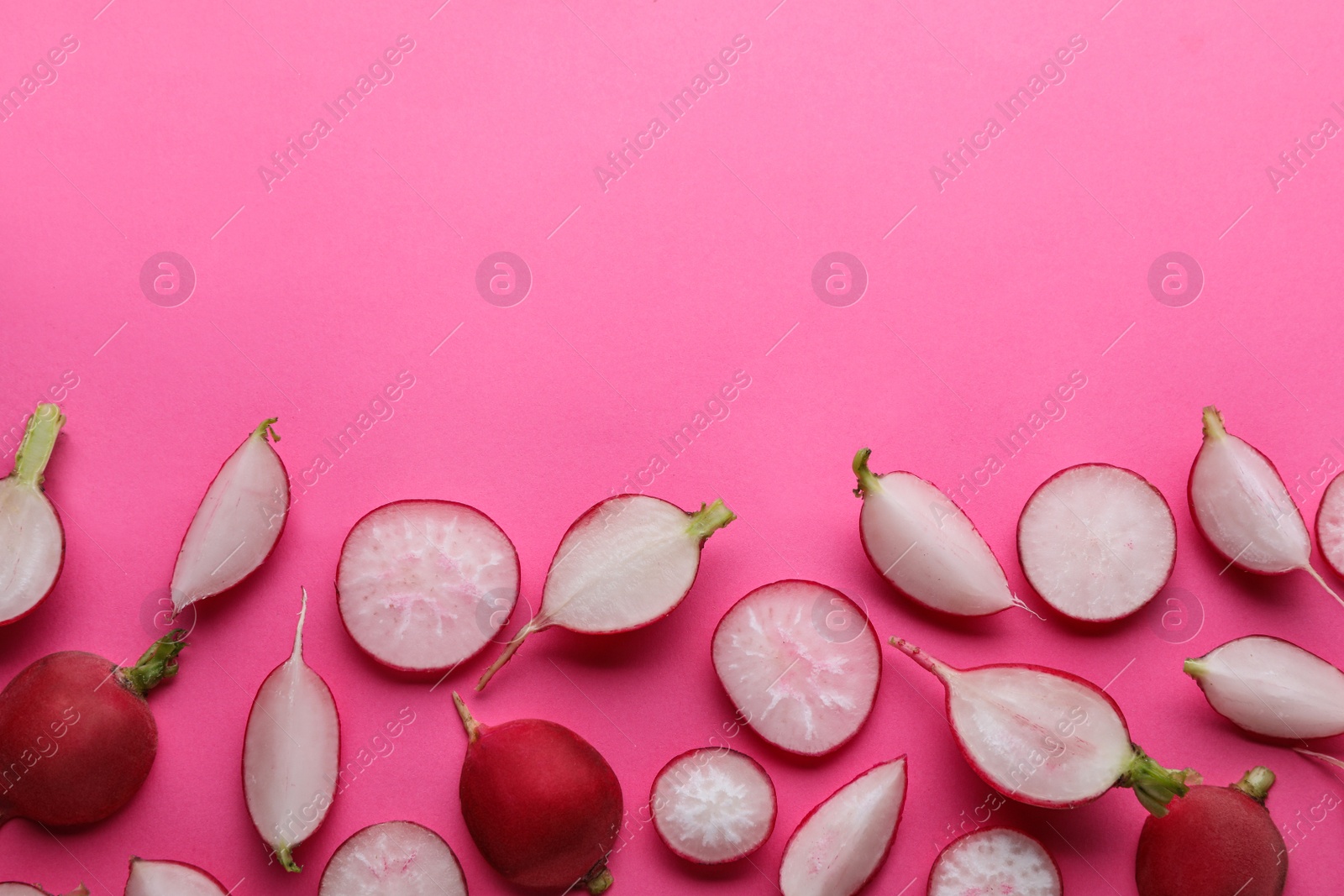 Photo of Fresh ripe radish on pink background, flat lay. Space for text