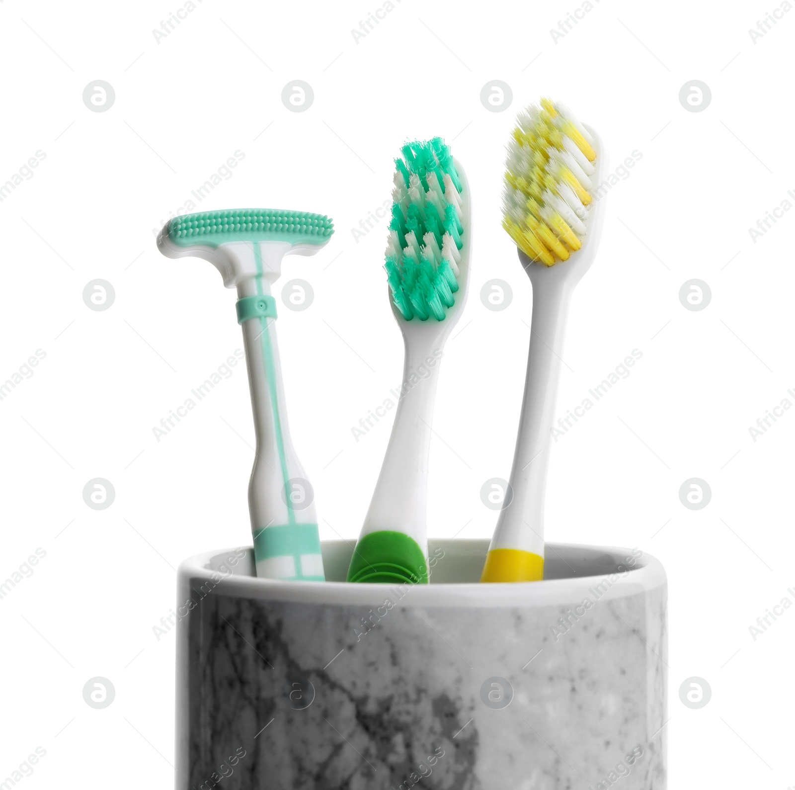 Photo of Holder with tongue cleaner and toothbrushes on white background