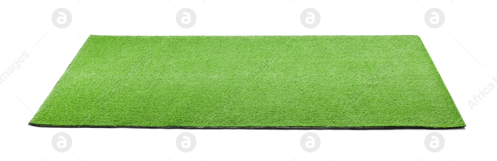 Photo of Green artificial grass carpet isolated on white