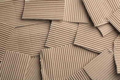 Photo of Pieces of cardboard as background, top view. Recycling concept