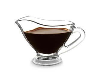 Photo of Glass gravy boat with balsamic vinegar on white background