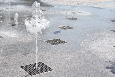 Photo of View of beautiful floor fountains on sunny day