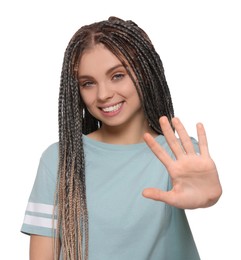 Young woman giving high five on white background