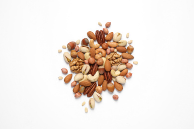 Photo of Different delicious nuts on white background, flat lay