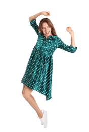 Photo of Beautiful young woman in green dress dancing on white background