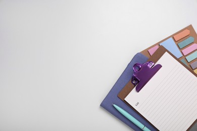 Photo of To do notes, planner and stationery on white background, flat lay. Space for text