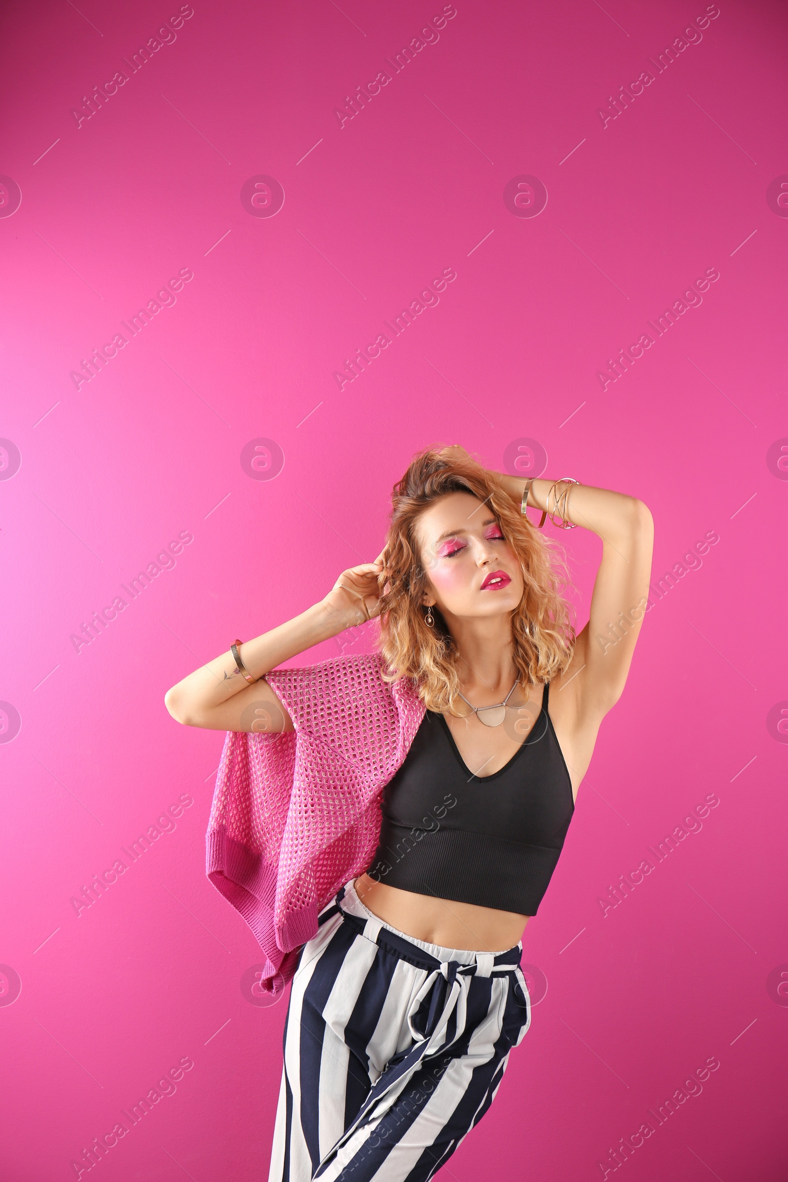 Photo of Beautiful young woman posing on color background. Summer fashion