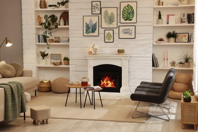 Photo of Stylish living room interior with comfortable chairs and decorative fireplace