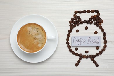 Photo of Alarm clock made of beans and card with phrase Coffee Break near hot drink on white wooden table, flat lay
