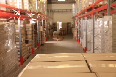 Image of Warehouse with lots of products, blurred view. Wholesale business