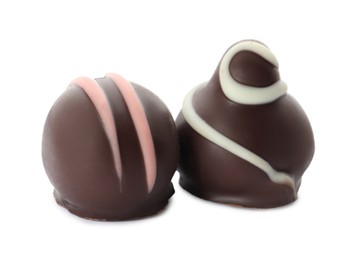 Photo of Different delicious chocolate truffles on white background