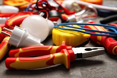 Photo of Set of electrician's tools on gray table