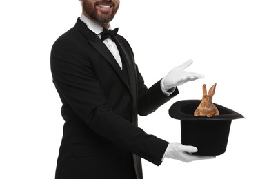 Image of Magician showing trick with top hat and rabbit on white background, closeup