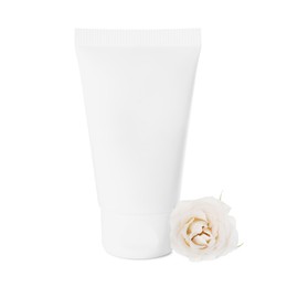 Photo of Tube of hand cream and rose on white background