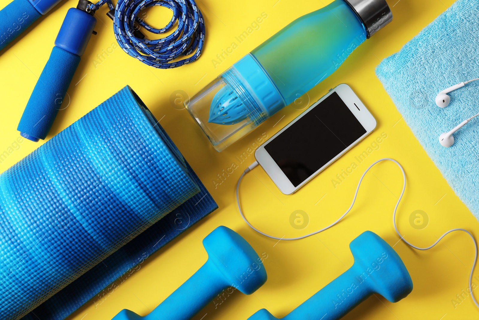 Photo of Flat lay composition with fitness gym equipment on color background