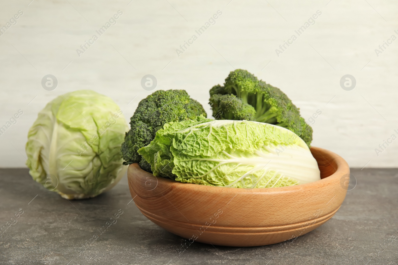 Photo of Plate with different cabbages on table. Healthy food